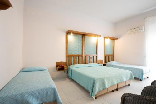 Katil atau katil-katil dalam bilik di Albergo Miramare