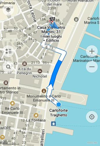 a map of montmartre with a blue arrow at B&B Terra - Stanza Natura in Carloforte