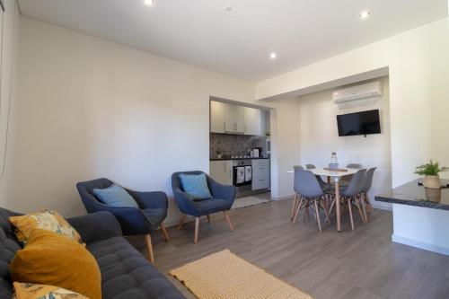 a living room with a couch and a table at Casa da Ponte Velha in Termas de Sao Pedro do Sul
