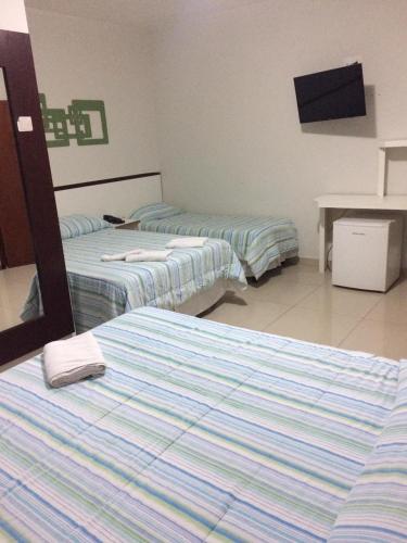 Postel nebo postele na pokoji v ubytování Alzira Plaza Hotel