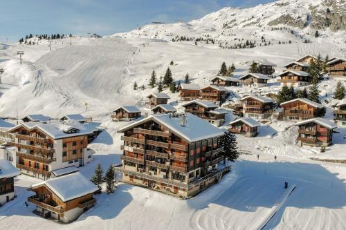 an aerial view of a resort in the snow at Topas 7 in Bettmeralp