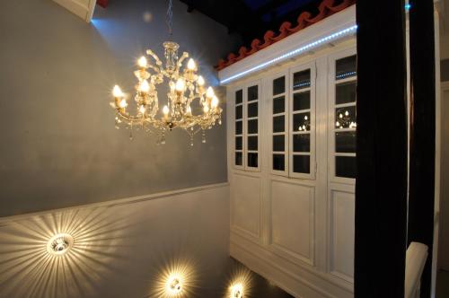 a chandelier in the corner of a room at il Palazzo Rooms & Suites in Nafplio