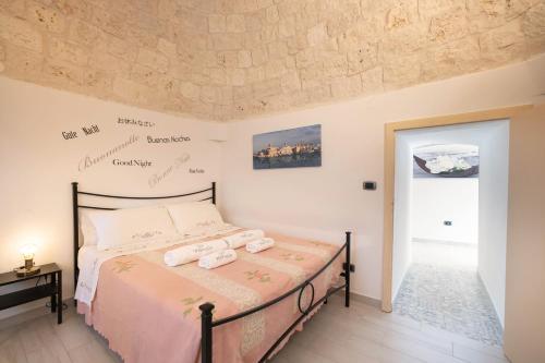 Katil atau katil-katil dalam bilik di WePuglia La Maison-D B&B