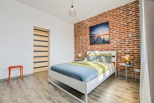 Una cama o camas en una habitación de Apartament SweetDream