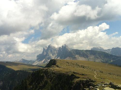a view of a mountain under a cloudy sky at Parkhotel Post in Chiusa