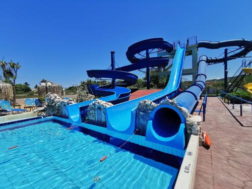 a blue water slide at a water park at Sidari Waterpark in Sidari
