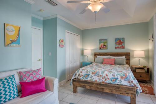 a bedroom with a bed and a couch at 417 Montego Bay Court, St. Augustine, FL 32080 in Butler Beach