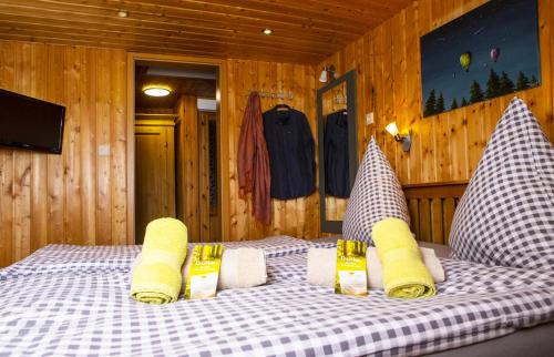 a bedroom with a bed with pillows on it at Ferienwohnung im Erzgebirge in Grünhain-Beierfeld