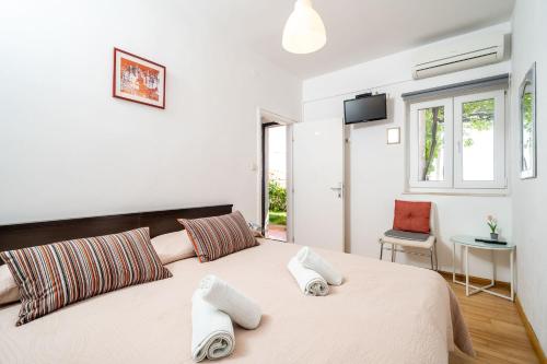 Ένα ή περισσότερα κρεβάτια σε δωμάτιο στο Rooms Rose