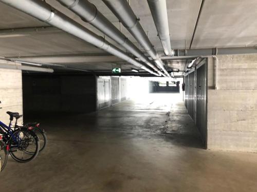 an empty parking garage with a bike parked in it at Luna27 in Toscolano Maderno