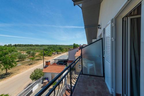 a balcony with a view of a road at Bed & Breakfast Maki in Biograd na Moru