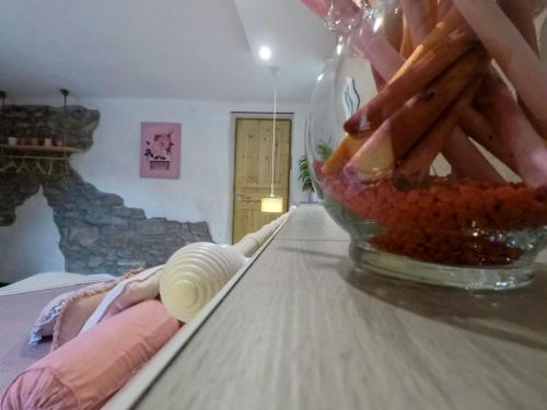 a table with a bowl of food on top of it at B&B La casa dei cuori in Millesimo