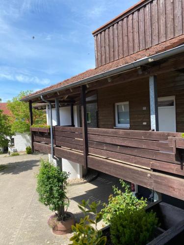 a house with a porch on the side of it at K 357 - Low budget Hotel in Ratekau bei Lübeck in Ratekau
