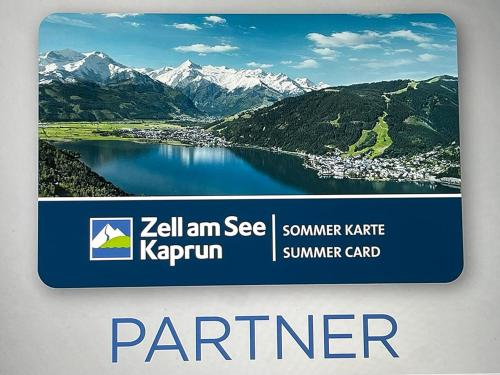 a sign with a picture of a lake and mountains at Pension Patricia - Summercard included from may 15th in Kaprun