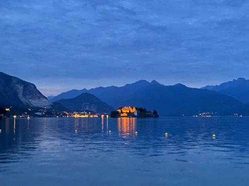 a house on an island in the middle of a body of water at Garden Lodge in Stresa