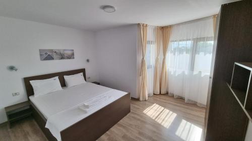 Ένα ή περισσότερα κρεβάτια σε δωμάτιο στο Casa Amy