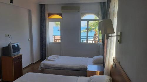 Postel nebo postele na pokoji v ubytování SERİN HOTEL