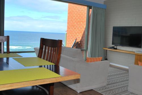 a living room with a view of the ocean at Whalevue - Unit 2 in Eden