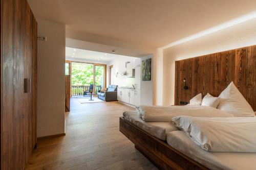 a large bedroom with two beds and a kitchen at Landgasthof zum Schützen in Oberried