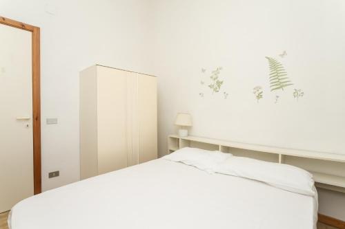 Säng eller sängar i ett rum på M79 - Marcelli, trilocale fronte mare in residence con piscina