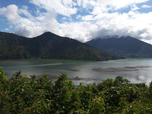 a large body of water with mountains in the background at Marlborough Sounds Accommodation 792 in Havelock