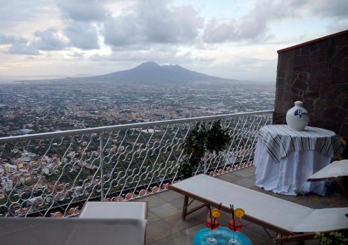 a bird sitting on a table on top of a balcony at HOTEL VALLEVERDE in Corbara