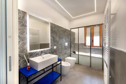 a bathroom with a sink and a toilet at Appartamenti fronte mare Otranto in Otranto