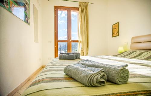 South Sardinia Holidays tesisinde bir odada yatak veya yataklar