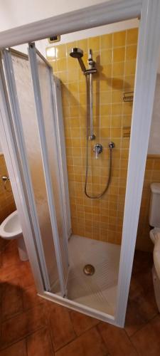 a shower with a glass door in a bathroom at Poggio Sasseta in Montiano