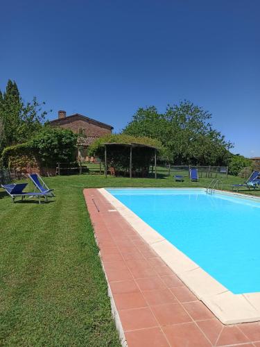 a swimming pool in the yard of a house at Podere Cartaio Bio Farm, private pool, AirC in San Rocco a Pilli