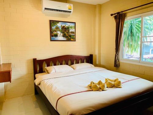 Postel nebo postele na pokoji v ubytování Benwadee Resort Pattaya