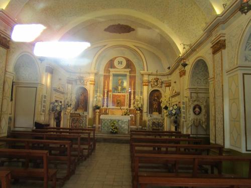 a large church with a bunch of pews in it at Apartamentos Marina Park in Oropesa del Mar