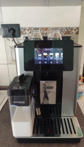 a coffee maker sitting on top of a counter at Don Giovanni in Alghero