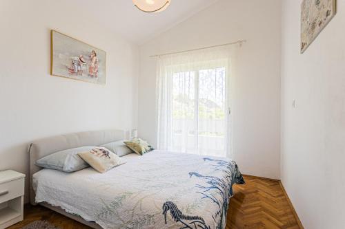 Posteľ alebo postele v izbe v ubytovaní VILLA ANA ZIVOGOSCE-Apartment4