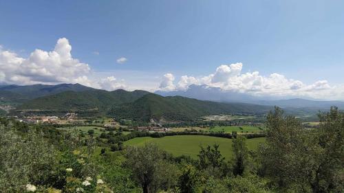 a view of a valley with trees and mountains at Hotel Rural LAbadia de Sieste in Sieste