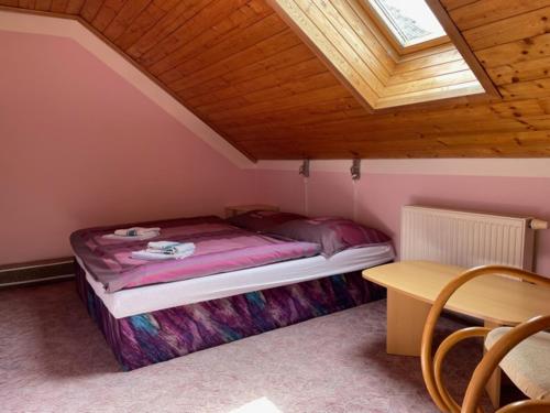 Ένα ή περισσότερα κρεβάτια σε δωμάτιο στο Penzion Jeseník