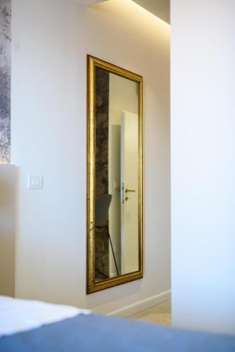 a mirror on a wall in a room at Villa Leoni in Dubrovnik