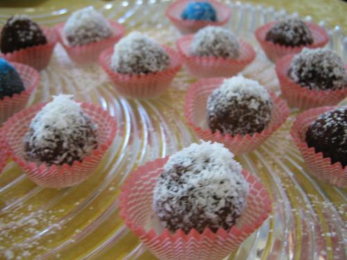 a bunch of pink cupcakes with powdered sugar on them at Hotel Du Parc in Atri