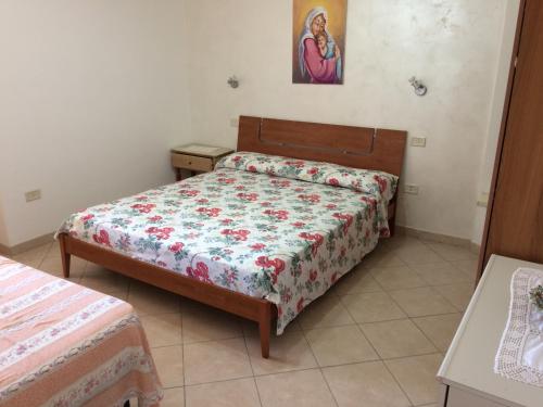 Posteľ alebo postele v izbe v ubytovaní Casa vacanze la tuia
