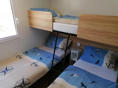 Posteľ alebo postele v izbe v ubytovaní SweetHome