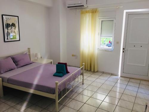 A bed or beds in a room at Korona beach apartments III