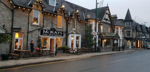 a street in a town with a building at 131 on Atholl in Pitlochry