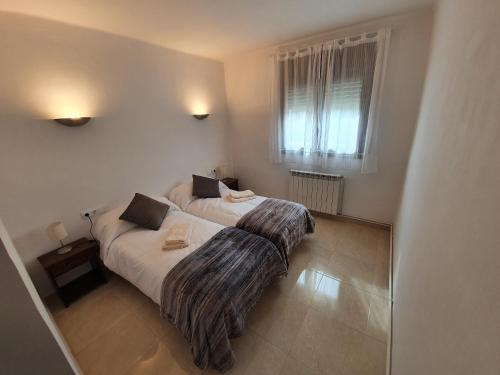 Postel nebo postele na pokoji v ubytování Apartament Vall de Ribes
