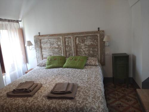Postel nebo postele na pokoji v ubytování Agriturismo LE CASE ROTTE