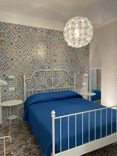 Ein Bett oder Betten in einem Zimmer der Unterkunft Sa Vivenda Suite