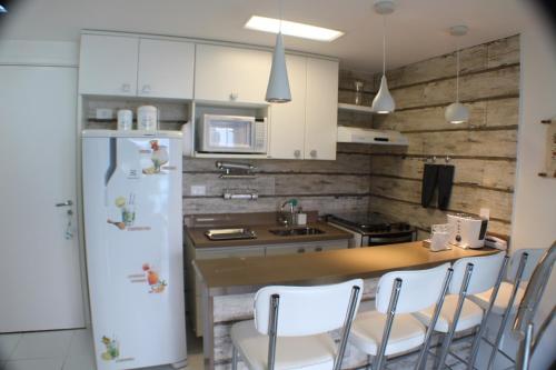 Dapur atau dapur kecil di Apartamento com cobertura em Porto Real Suítes