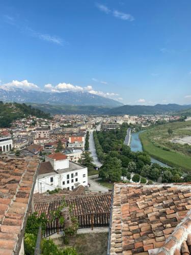 a view of a city with a river and mountains at Aria Baci Guest House in Berat