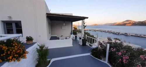 a white house with a view of the water at Bella Vista in Panteli