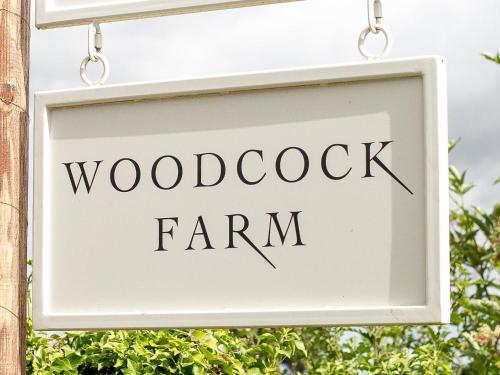 a sign that reads woodcock farm at Woodcock Farm in Bristol