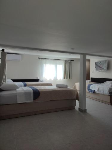 מיטה או מיטות בחדר ב-Meliria Apartments
